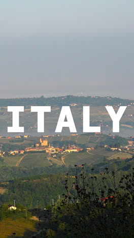 Vertical-Video-Aerial-Drone-Shot-Of-Villages-And-Mountains-In-Italy-With-Animated-Graphic-Spelling-Out-Italy